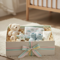 Luxe Baby Birthday Gift Box with plush teddy, rattle, booties and swaddle blanket in white and mint box