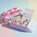 Luxe Teen Girl Birthday Gift Box with lip gloss, hair accessories and journal in lilac box with pink ribbon