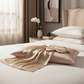 Luxe Silk Pillowcase Set in champagne gold and blush pink on white bed linen